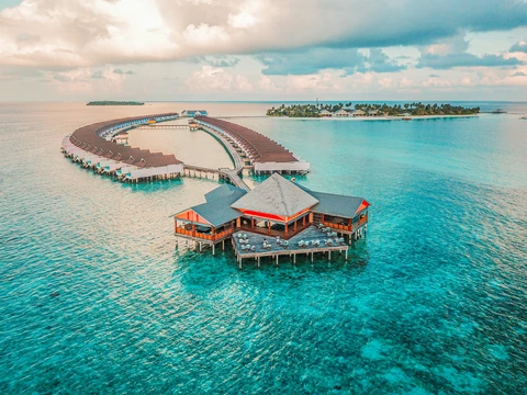 Overwater bungalows on turquoise Maldivian sea